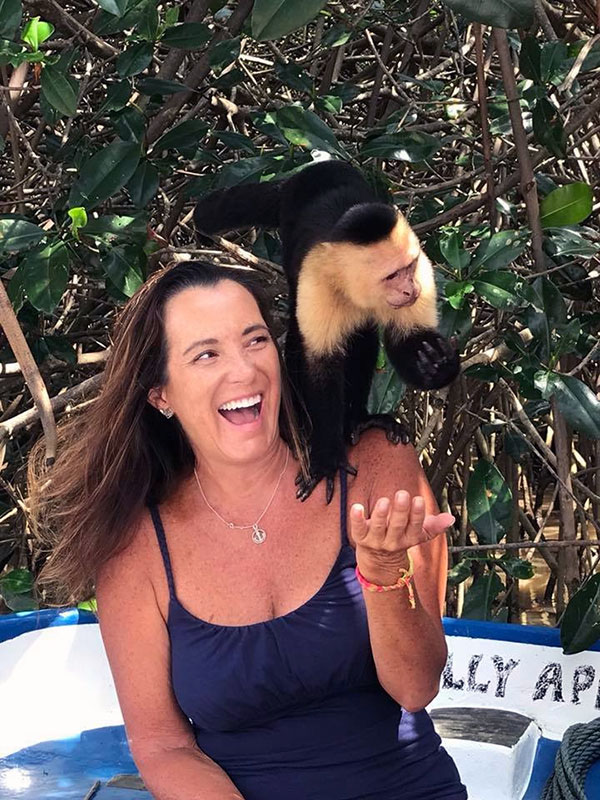 🇨🇷 PANAMA POSSE SEASON 1 - Christine and a freindly Capuchin monkey at Manuela Antonio NP SY SUGAR SHACK currently at  23 08.567' S 135 01.464 W