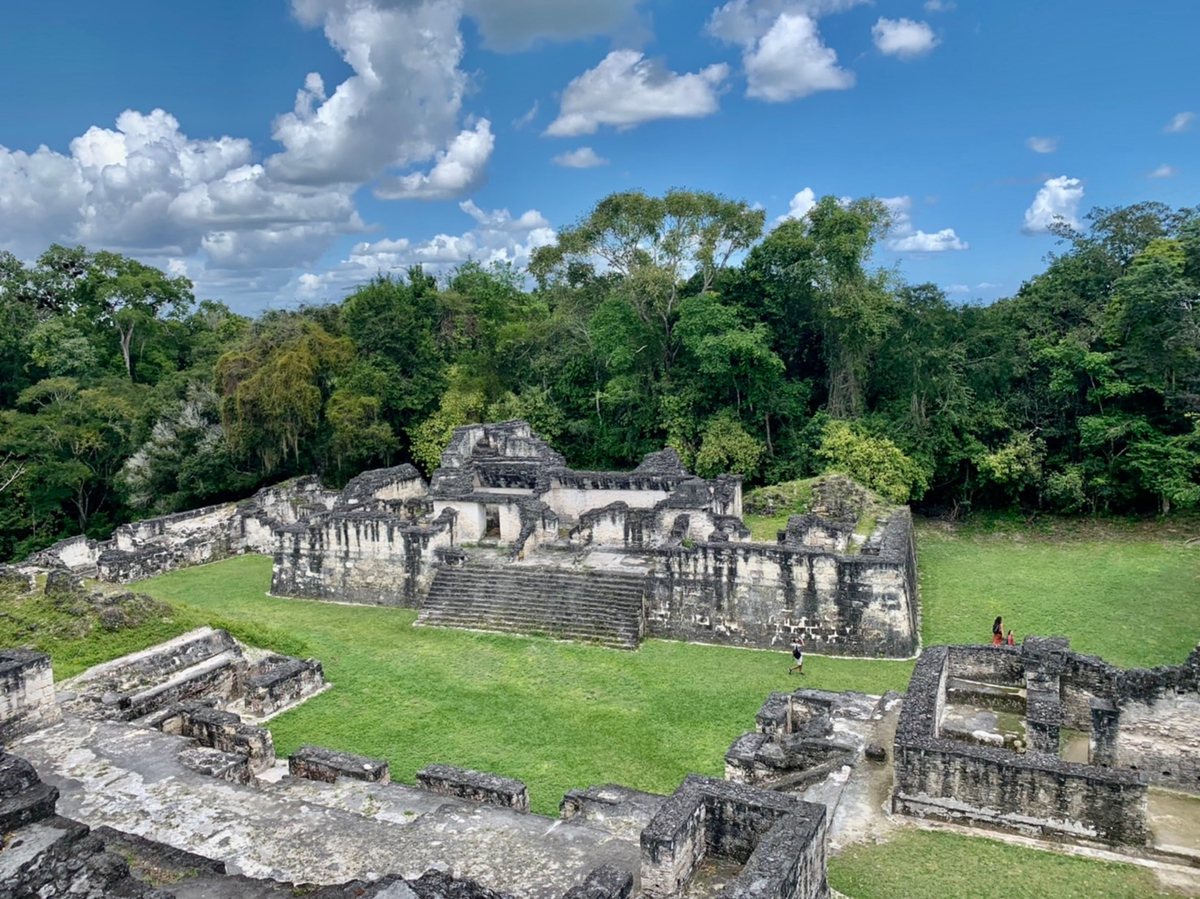 The topography of the site consists of a series of parallel limestone ridges rising above swampy lowlands. The major architecture of the site is clustered upon areas of higher ground and linked by raised causeways spanning the swamps.